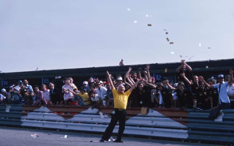 Colin Chapman arms aloft 1978 Spanish GP