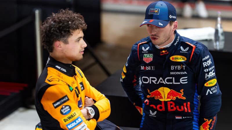 Max Verstappen talks to Lando Norris